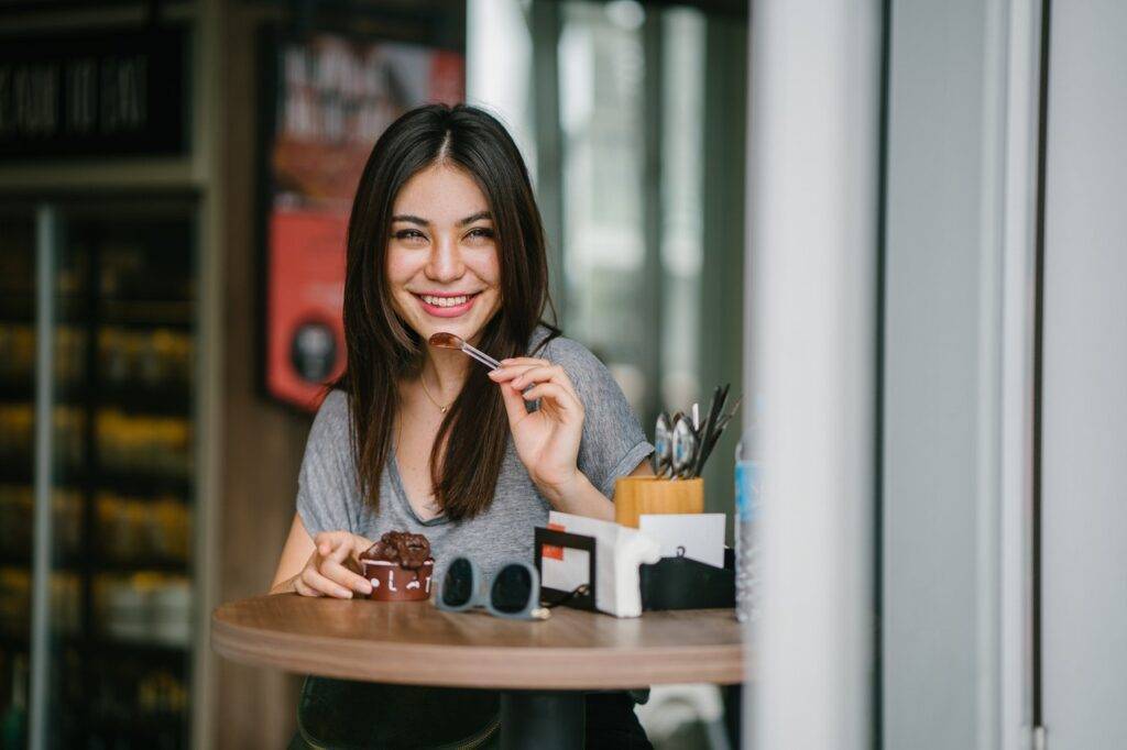 Girl eating chocolate ice cream