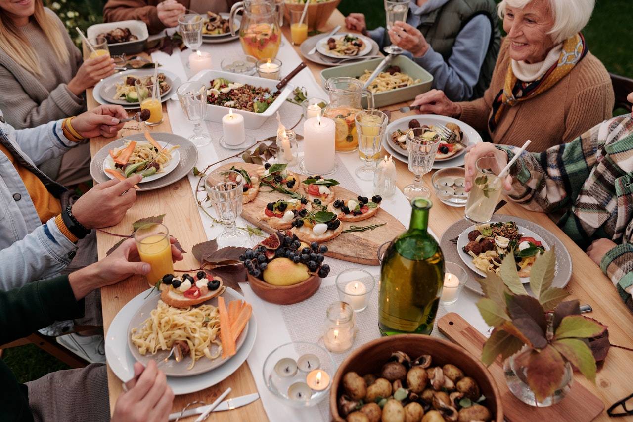 Dining table with people and food