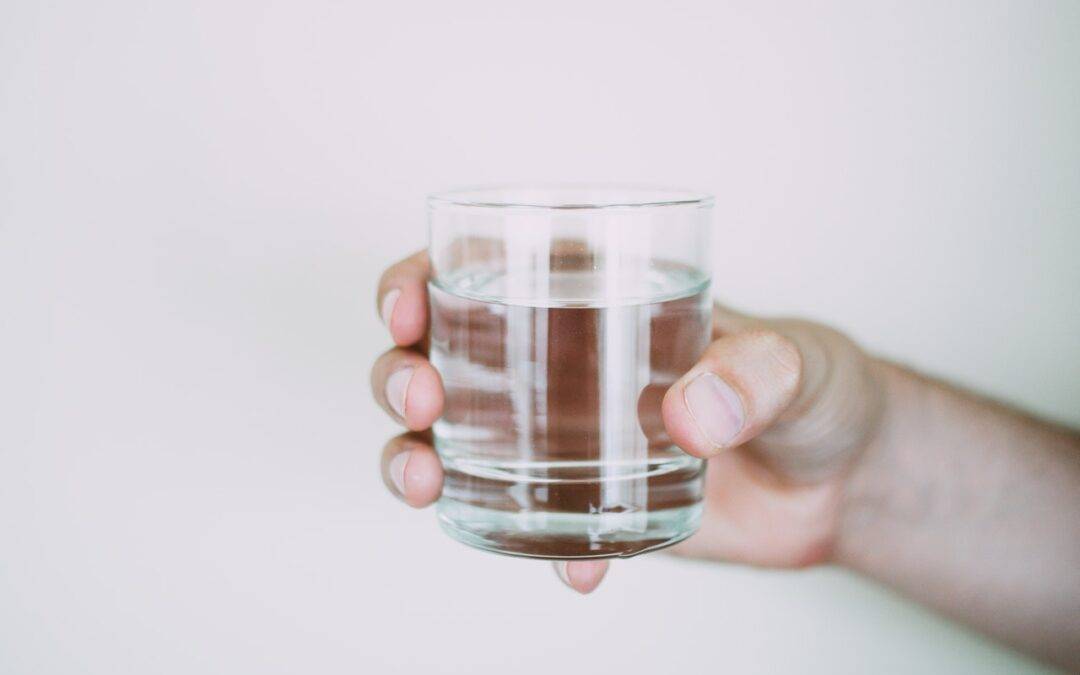 Holding a glass of water