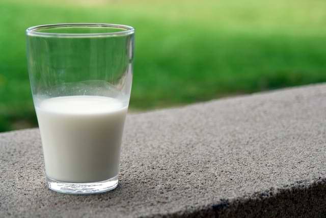 Glass Cup of Milk on Ledge