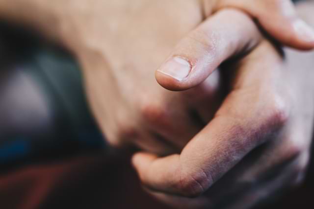 Man with Hands Crossed with Thumbnail Showing
