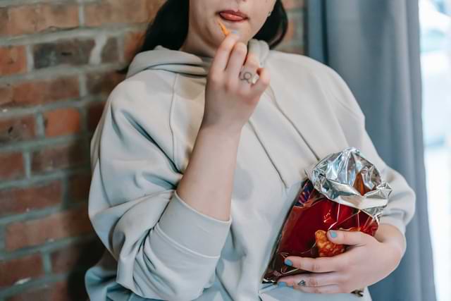 Girl with Bag of Chips Open